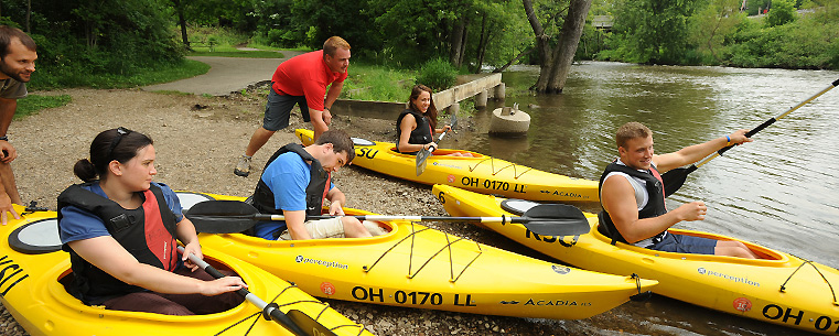 <p><font><font size="2">Recreational Services employees launch kayaks into the river in downtown Kent, as part of a new canoe and kayak livery at John Brown Tannery Park.</font></font></p>
